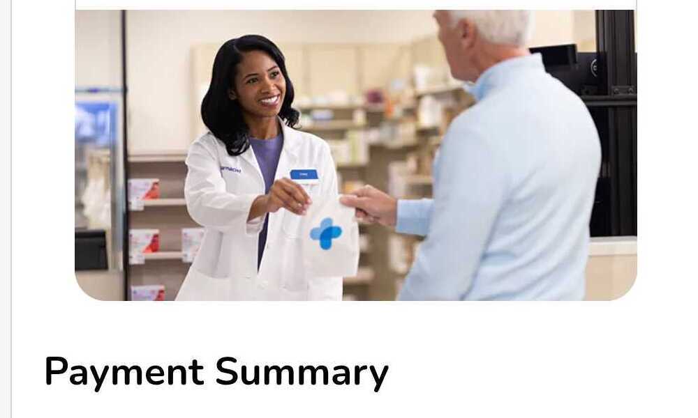 Kroger pharmacist handing a prescription to a customer